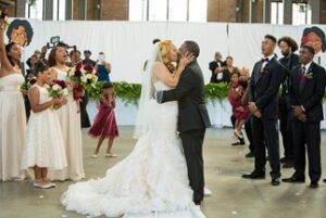 Mr. & Mrs. Corey and Erika Jackson kissing at the their wedding.