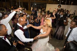Tyrone Jackson dancing with the daughter-in-law Erika at the wedding